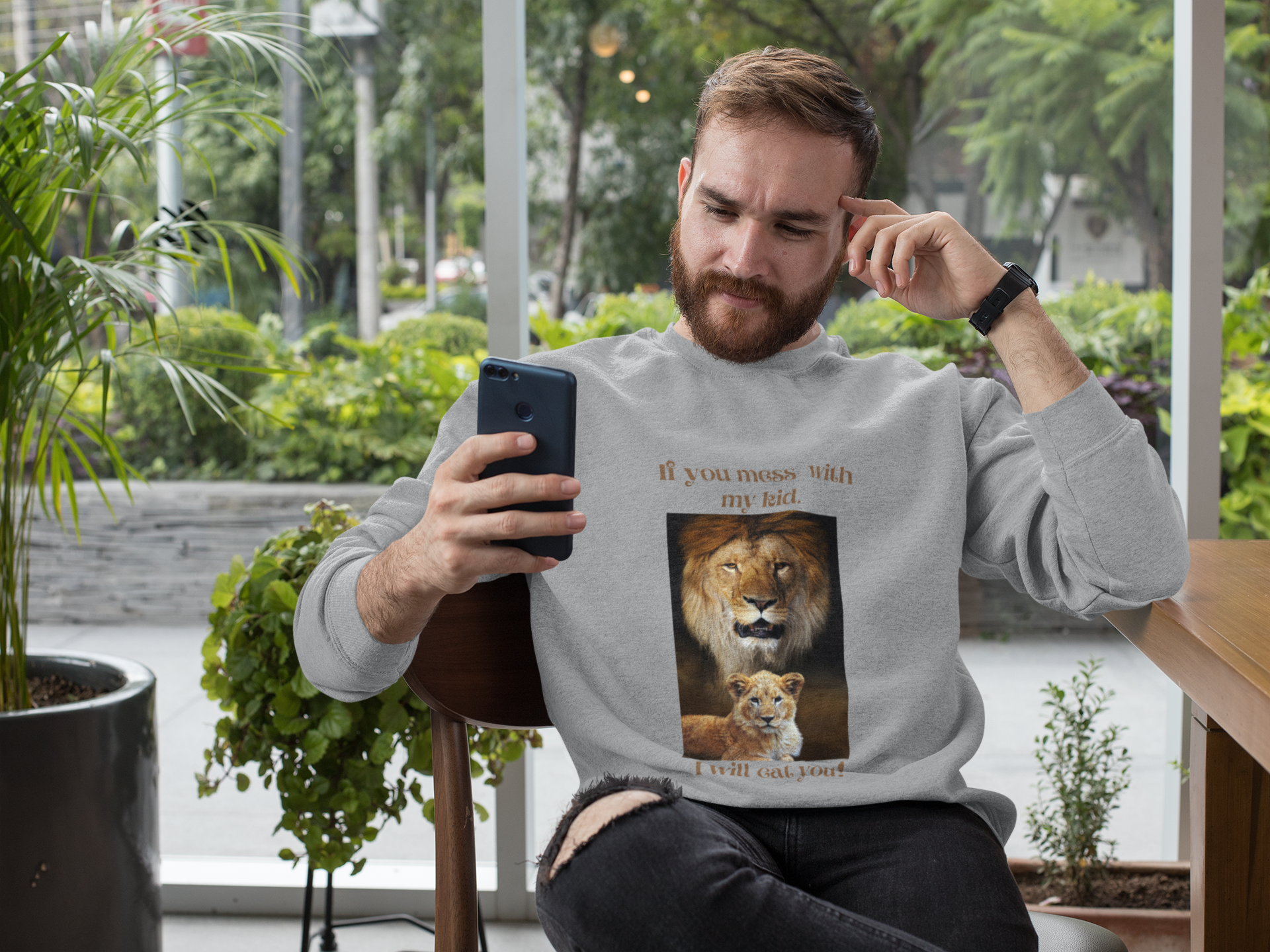 Man in a Grey Sweatshirt with a Wild Animal Graphic